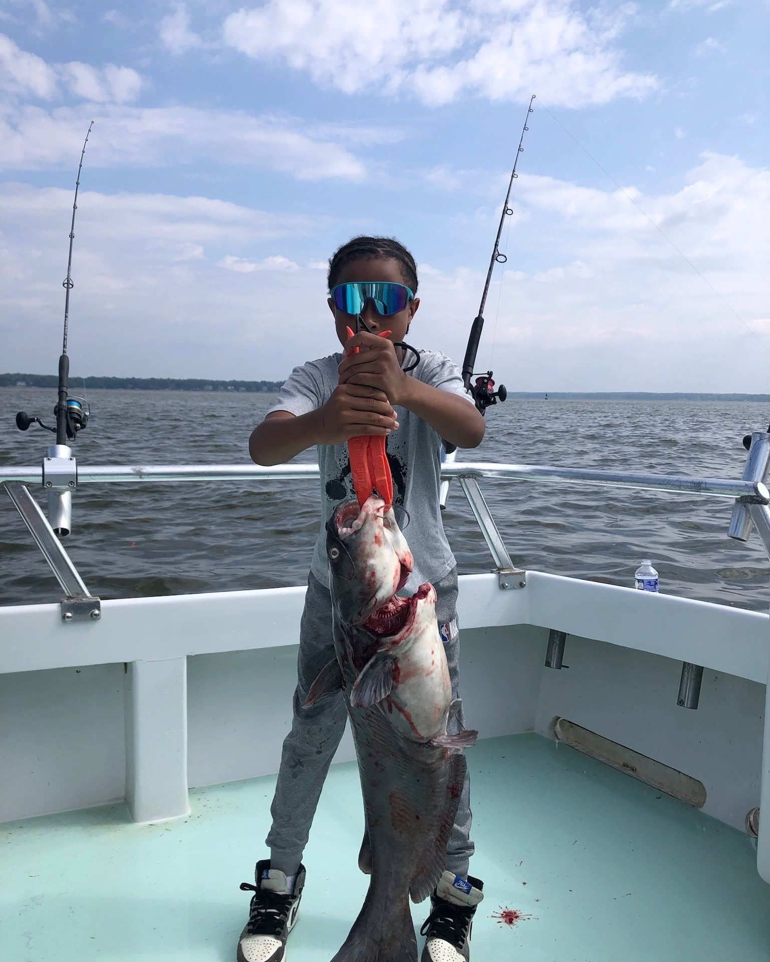 Chesapeake Bay Charter Fishing Report: The Last Week for Summer Rockfish 2 Boy catches giant catfish!